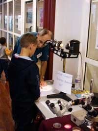 David Rome demonstrating a
                  projecting microscope